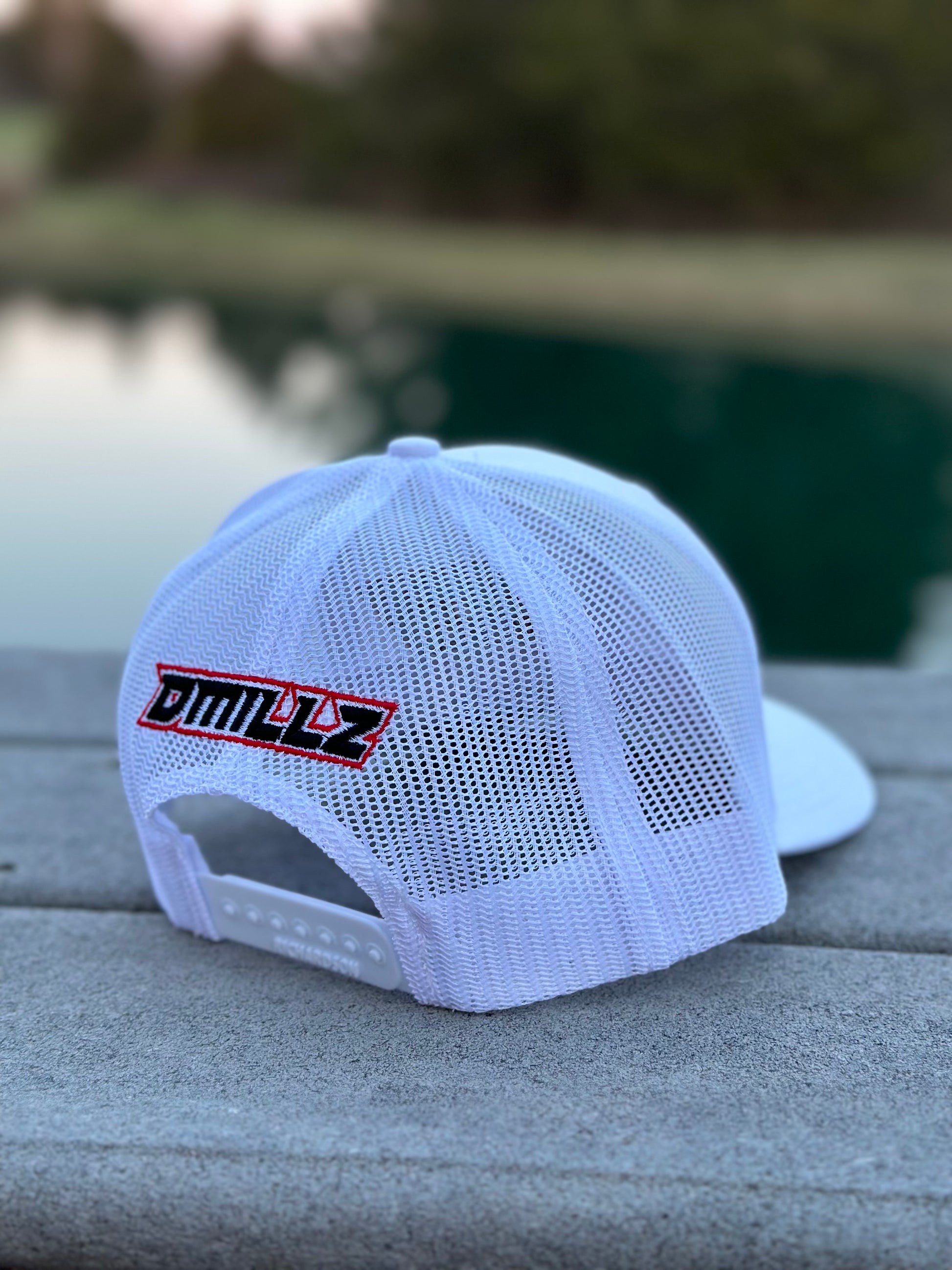 back of white hat with DMILLZ embroidered on rear